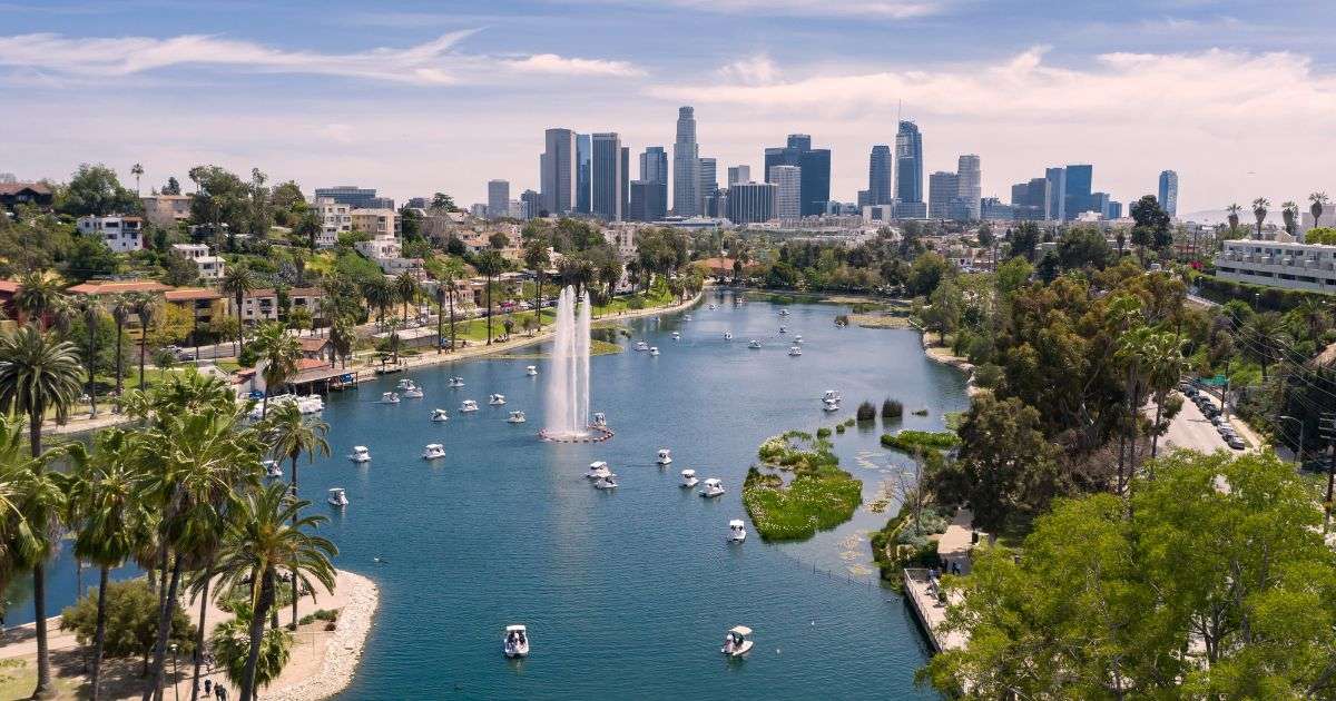 Echo Park Lake in the Echo Park neighborhood in Los Angeles with the downtown LA skyline in the background
