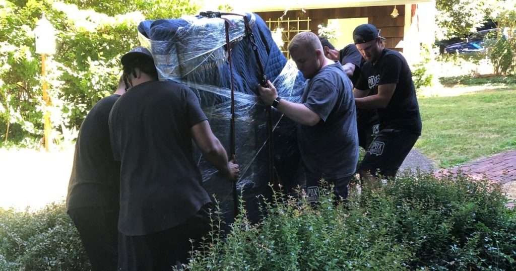 A group of moving professionals helping a family with moving to Portland Oregon