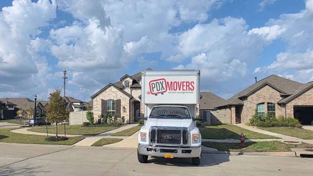 PDX Movers' truck parked outside a residence during a move in Cypress TX