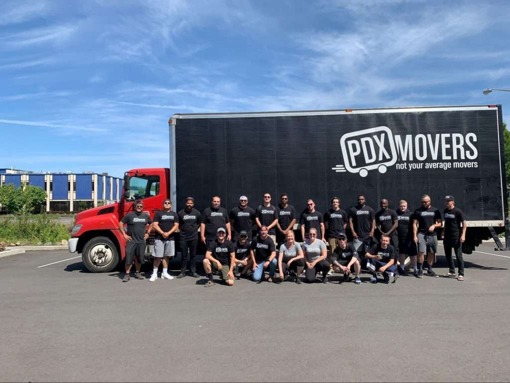 PDX Movers team in front of a company truck