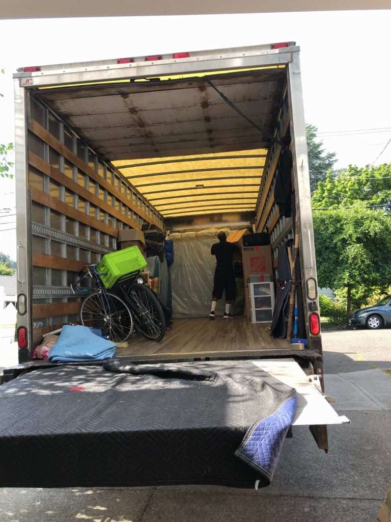 PDX team member emptying moving truck